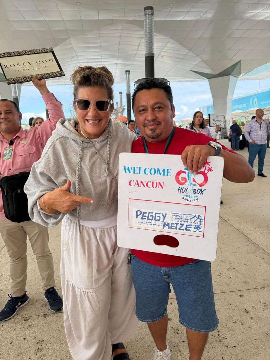 Enrique, Go Holbox Shuttle driver, welcoming a guest at Cancún Airport with a personalized sign